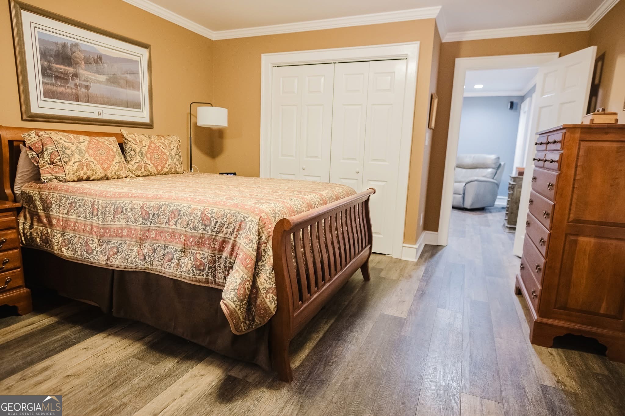 410 Country Kitchen Road Barnesville, GA 30204 - Photo 31 of 120 a bedroom with a bed and a painting on the wall