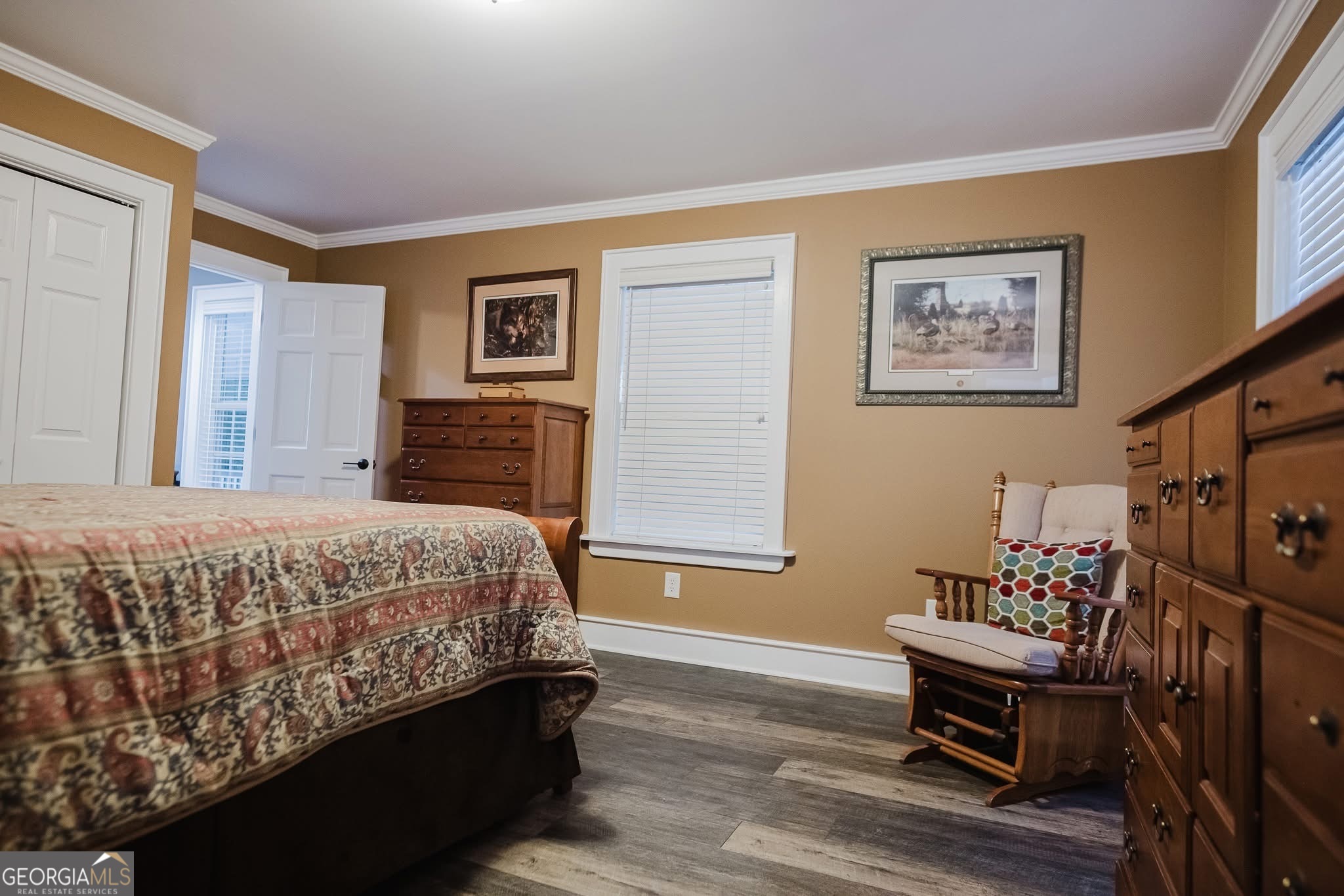 410 Country Kitchen Road Barnesville, GA 30204 - Photo 32 of 120 a bedroom with a bed and wooden floor