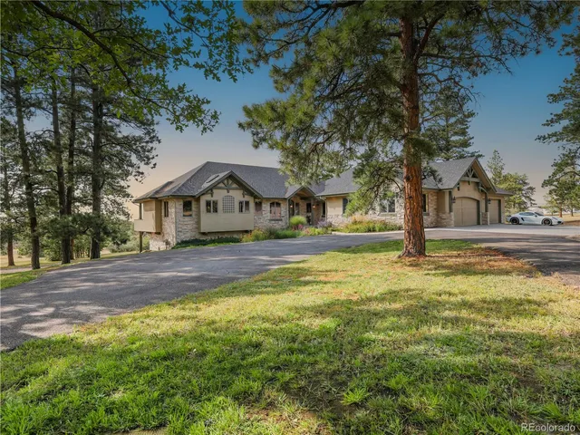 a house view with swimming pool and wooden fence