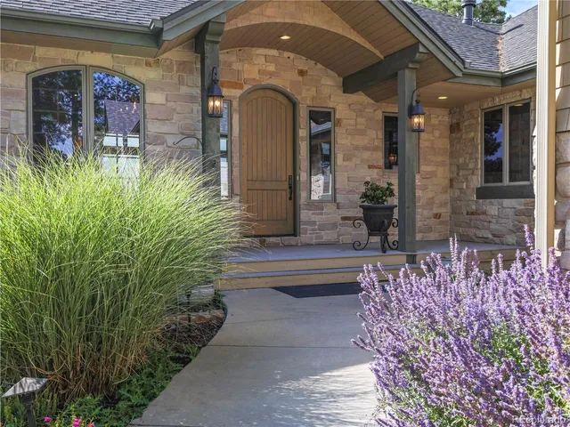 a living room with fireplace furniture and a wooden floor