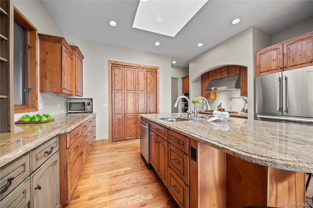 a bedroom with a bed couch and window