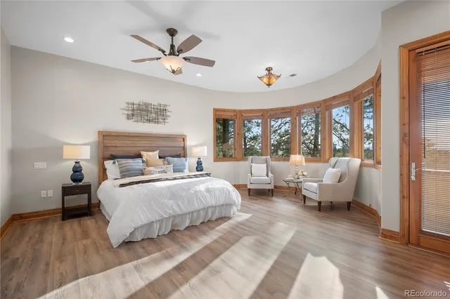 a view of a dining room with furniture wooden floor and chandelier