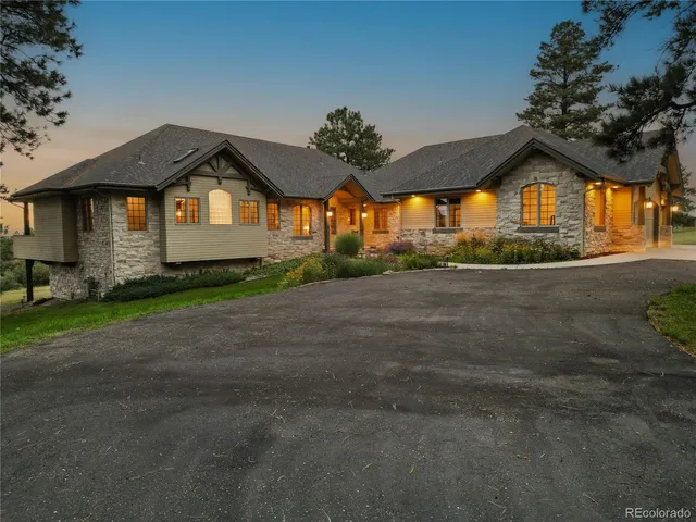 a view of a lake with a yard and mountain view