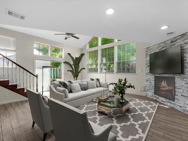 a living room with furniture fireplace and a flat screen tv
