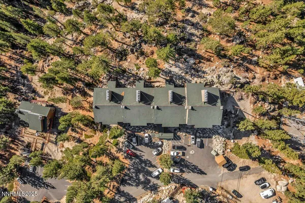a large building with trees in front of it
