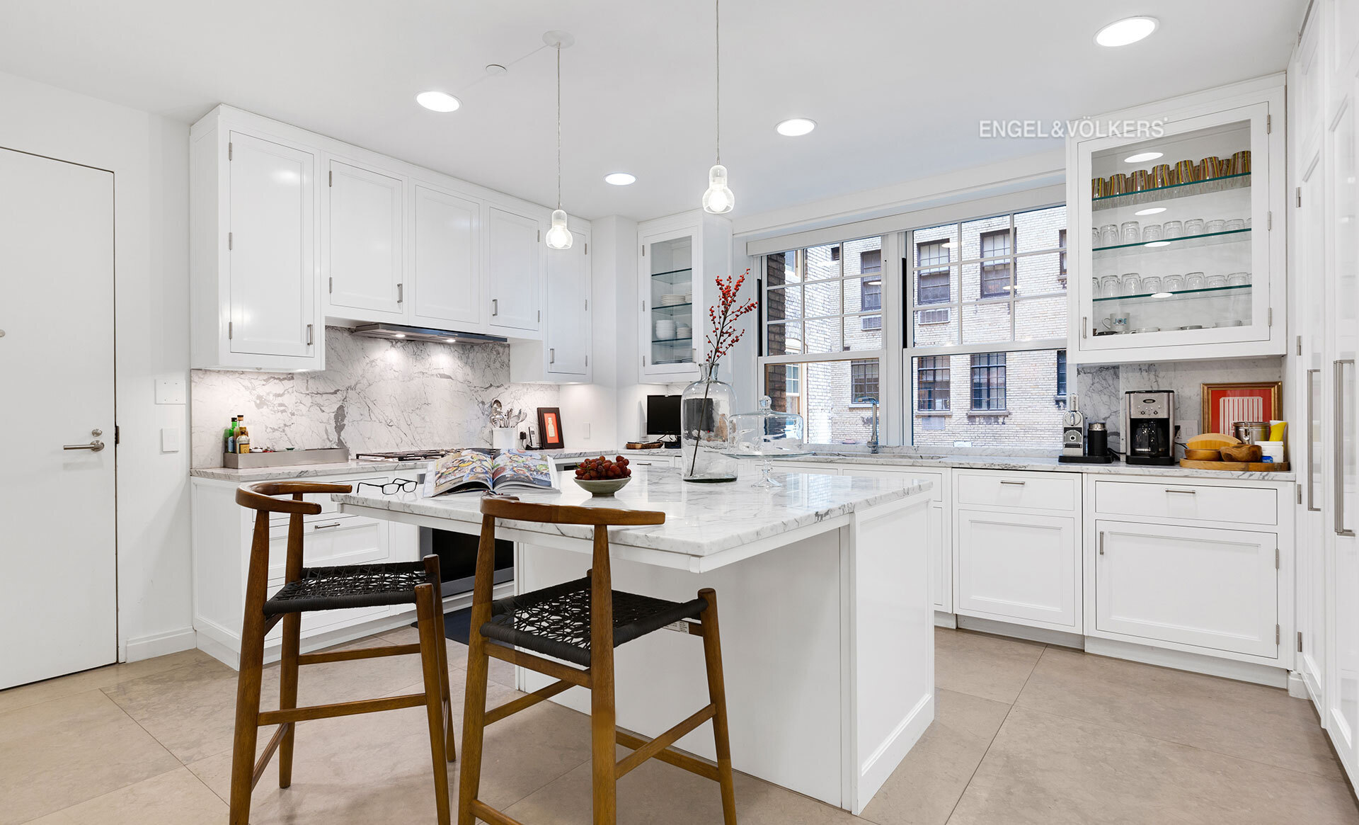 150 East 72nd Street, Unit 4S Manhattan, NY 10021 - Photo 3 of 13 a kitchen with stainless steel appliances kitchen island granite countertop a sink and cabinets