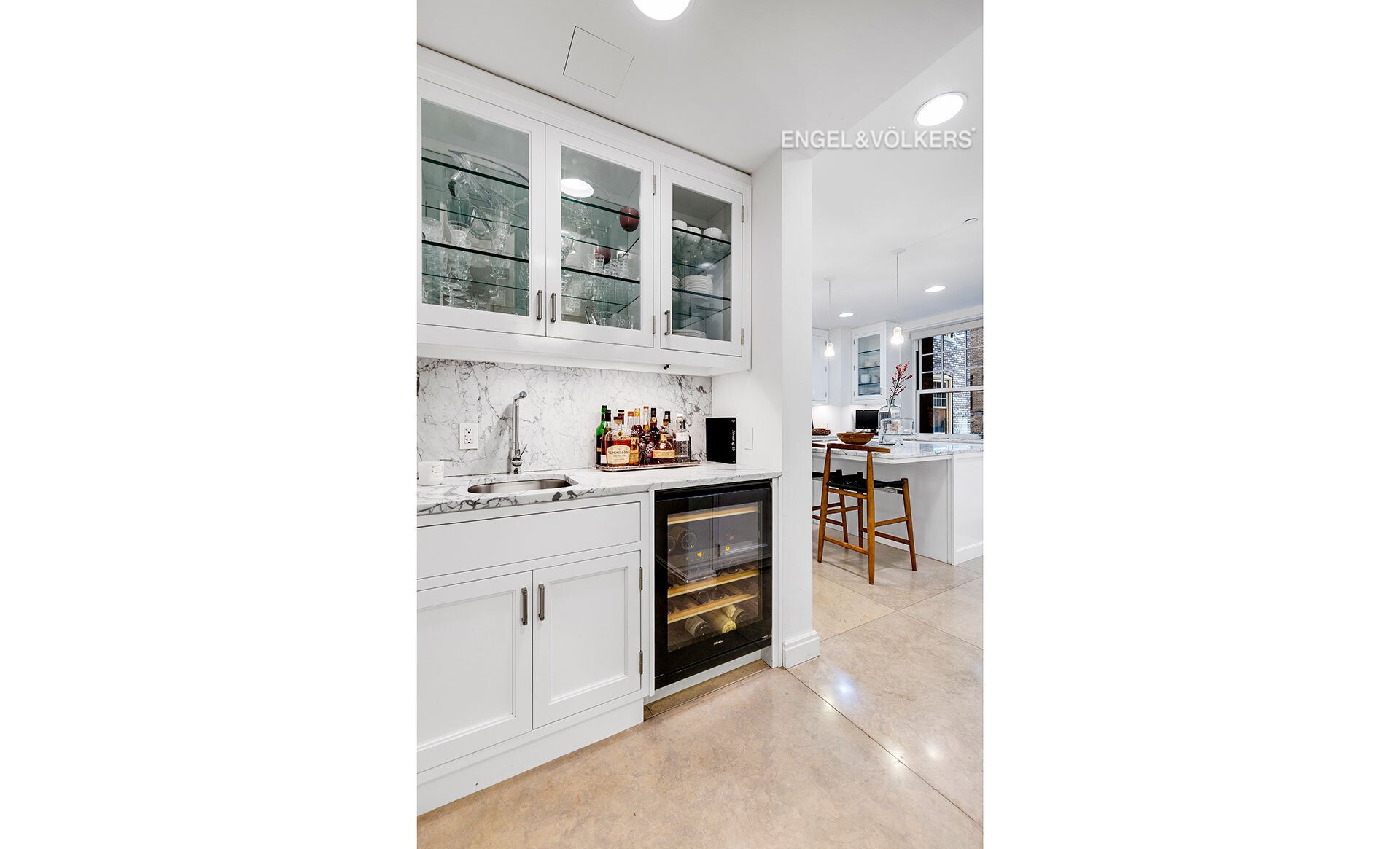 150 East 72nd Street, Unit 4S Manhattan, NY 10021 - Photo 4 of 13 a kitchen with cabinets and window