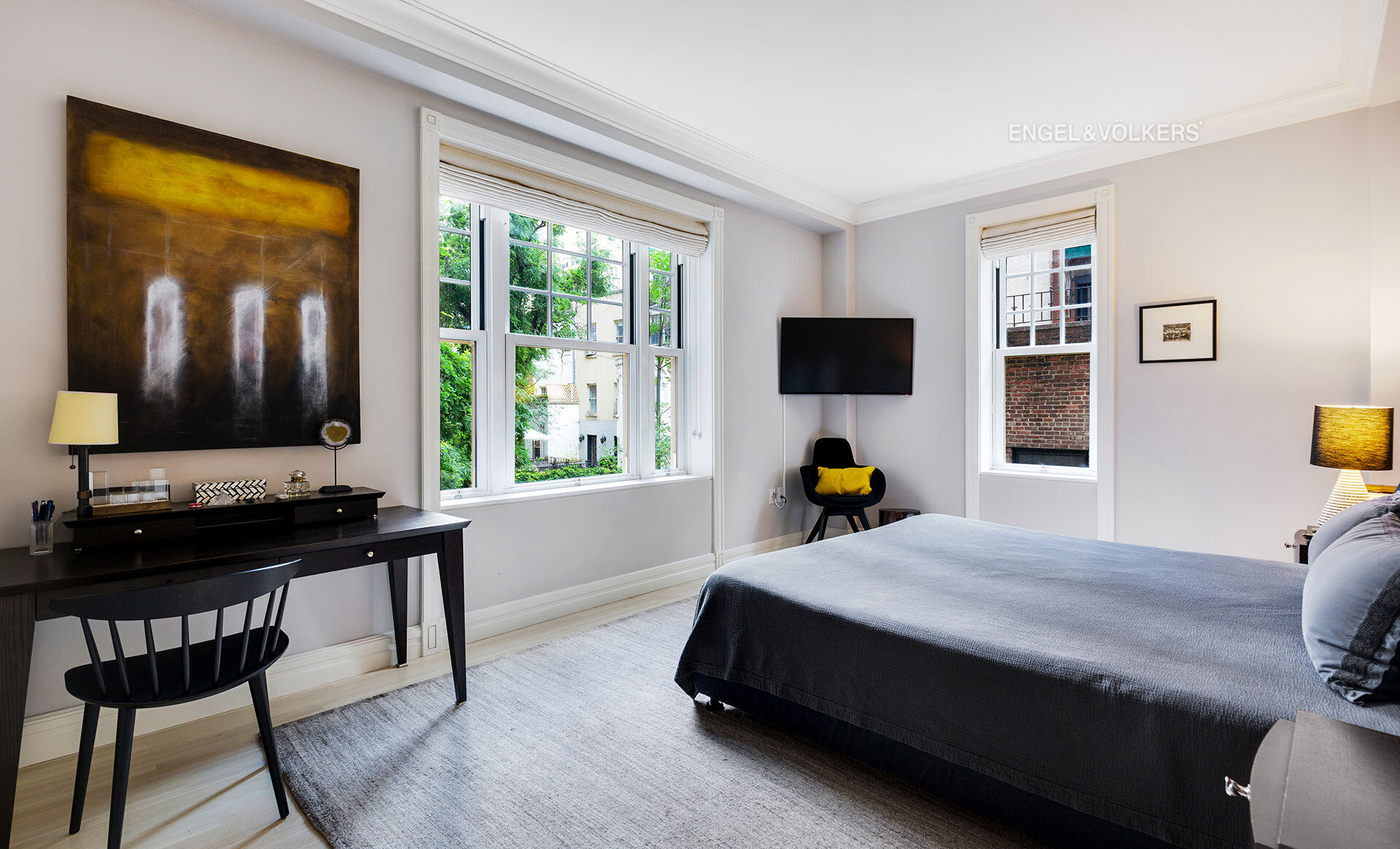 150 East 72nd Street, Unit 4S Manhattan, NY 10021 - Photo 6 of 13 a bed room with a bed and a flat screen tv