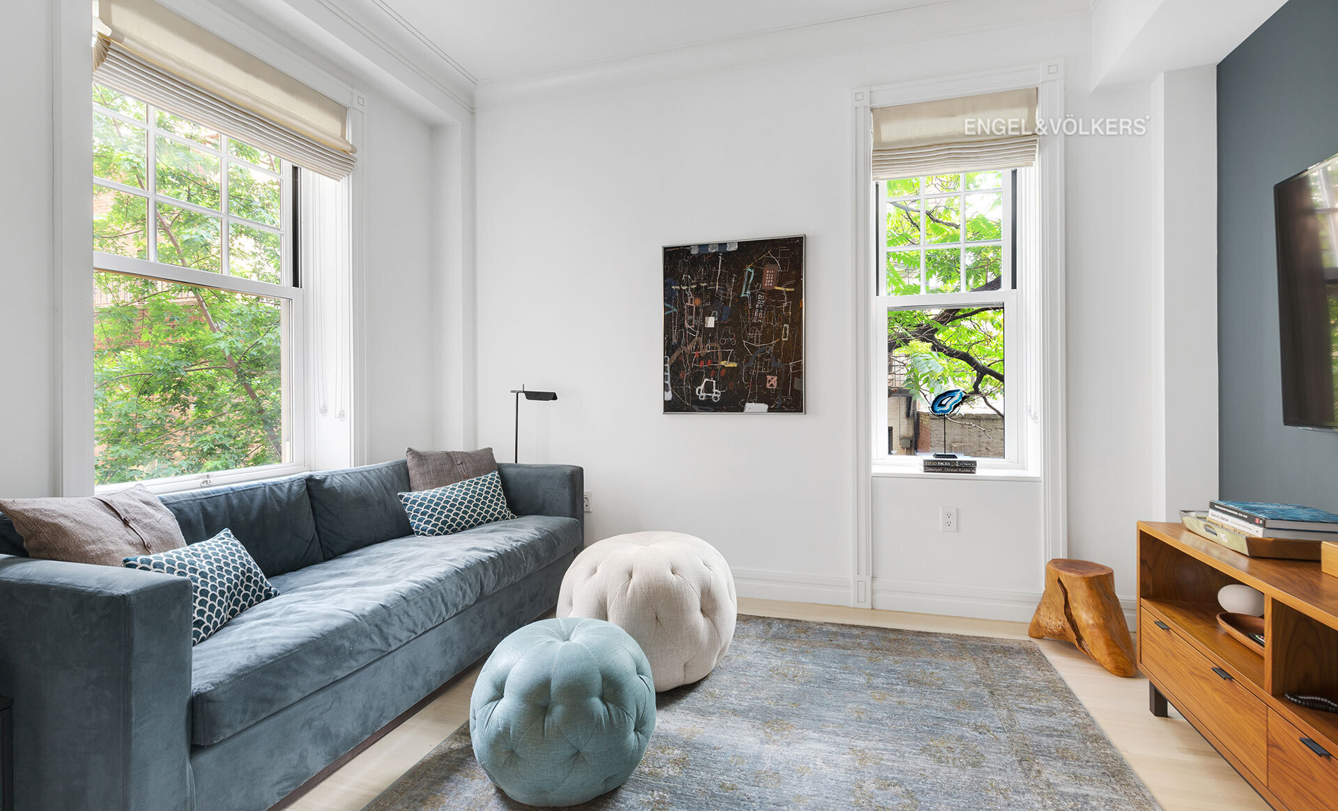 150 East 72nd Street, Unit 4S Manhattan, NY 10021 - Photo 9 of 13 a living room with furniture and a window