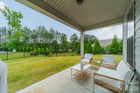 a view of yard with outdoor seating and green space