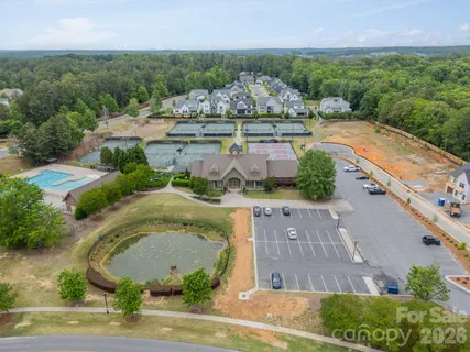 an aerial view of a house with outdoor space