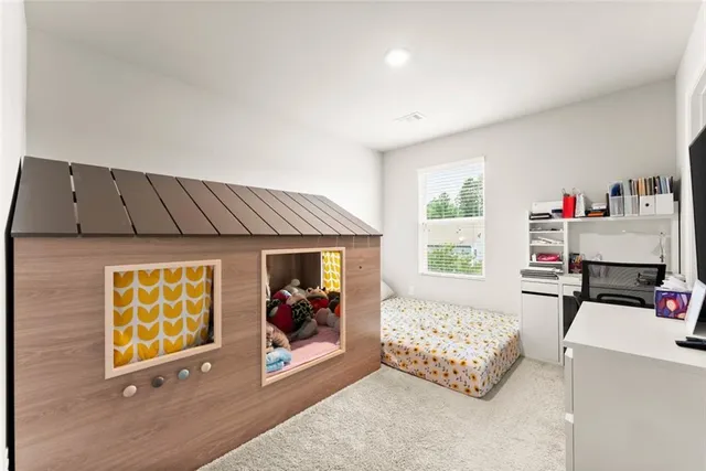 a bedroom with furniture and a window