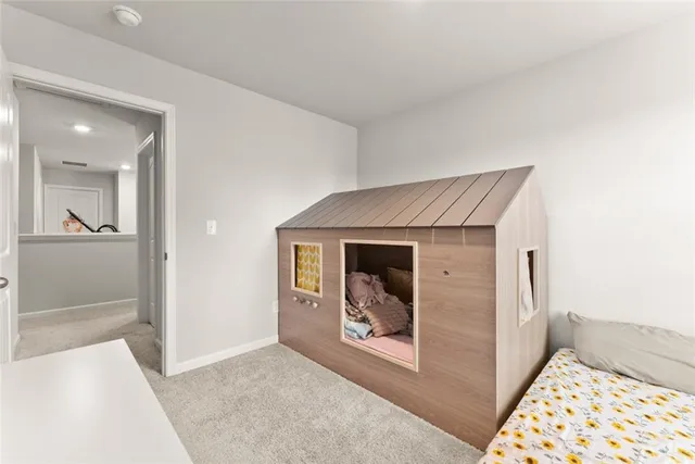 a view of a hallway to a bedroom and utility room