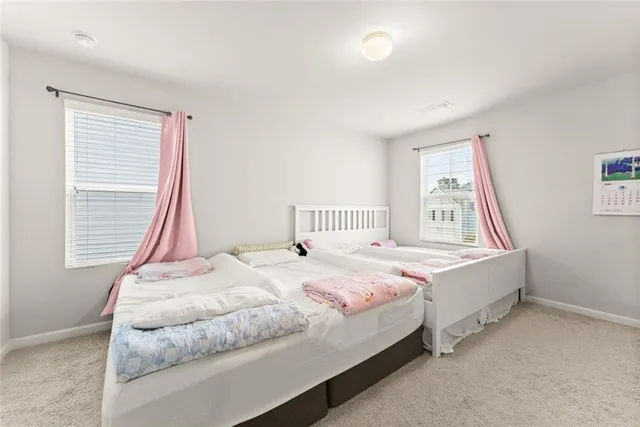 a bedroom with a bed and window