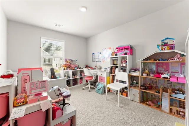 a utility room with cabinets and washer dryer