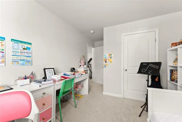 a room with furniture a gym equipment and a window