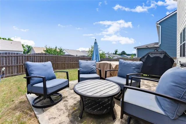 a view of swimming pool with a lounge chair