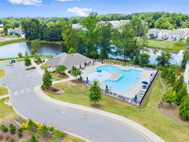 an outdoor space with furniture and umbrella