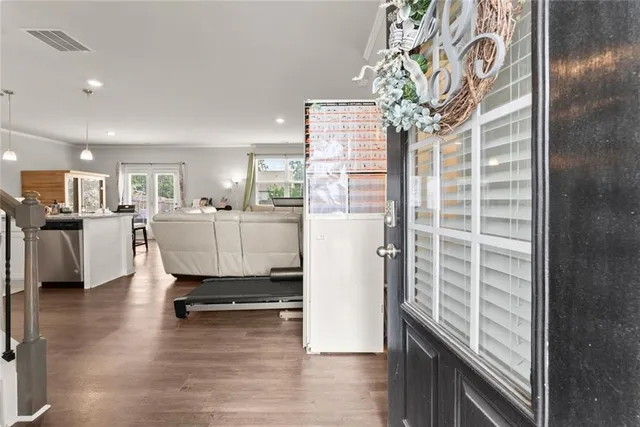 a dining room with furniture and a chandelier