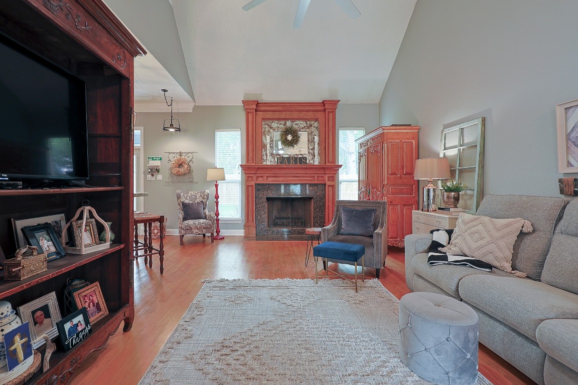 4704 Donald Street Seabrook, TX 77586 - Photo 13 of 42 a living room with furniture flat screen tv and a fireplace