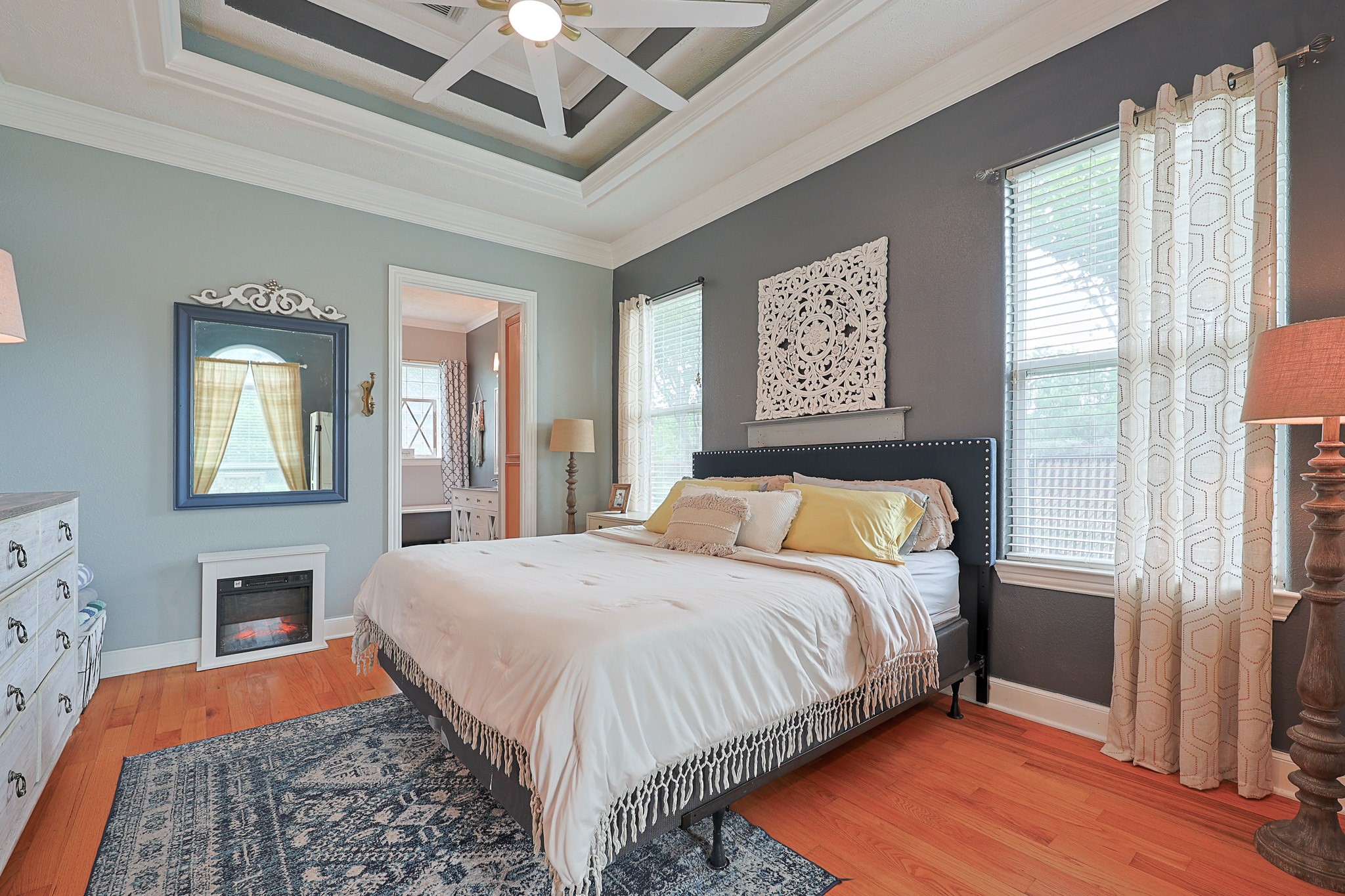 4704 Donald Street Seabrook, TX 77586 - Photo 25 of 42 a bedroom with a bed and a dresser next to a window