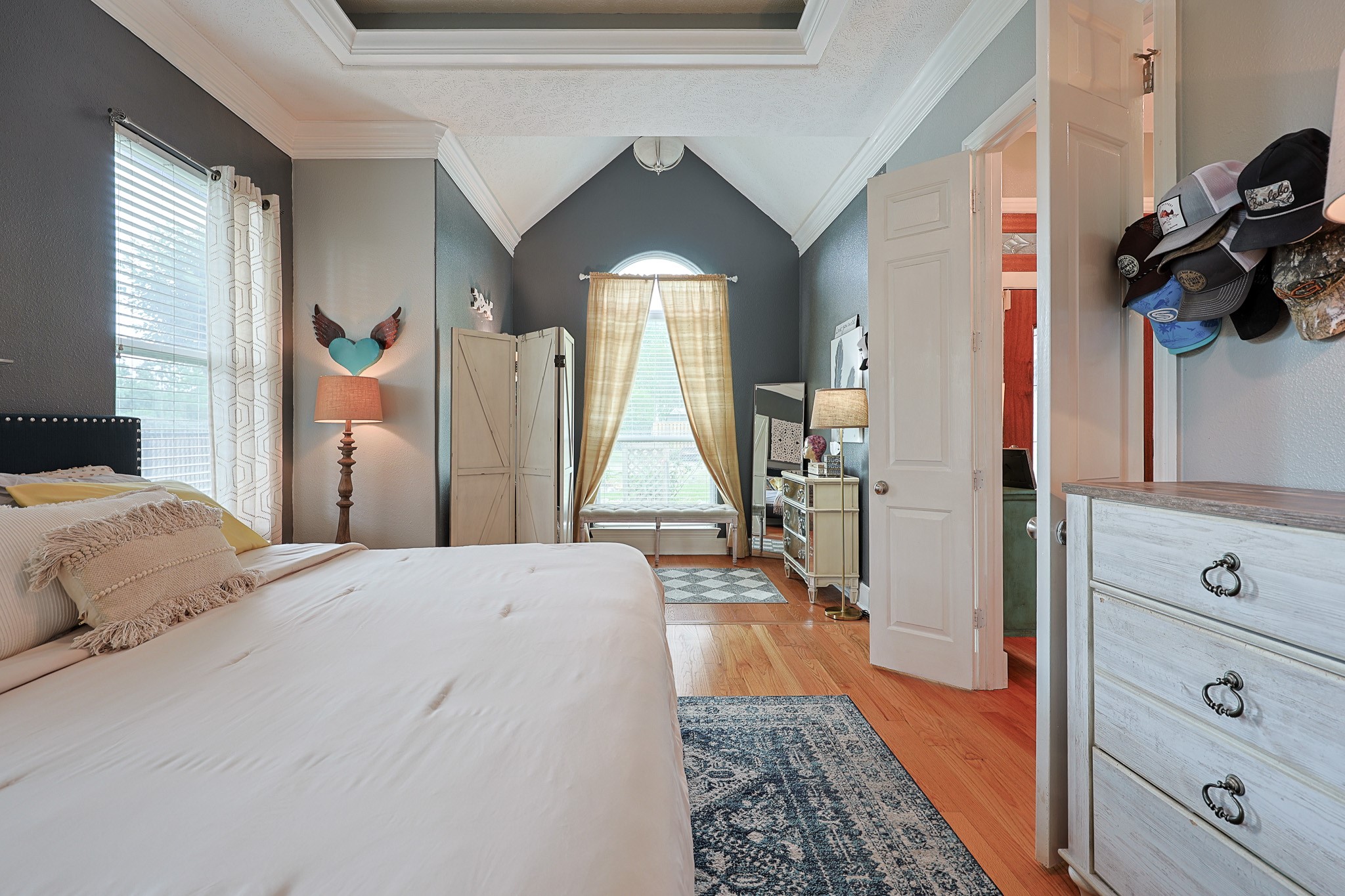 4704 Donald Street Seabrook, TX 77586 - Photo 26 of 42 a bedroom with a bed a mirror and dresser