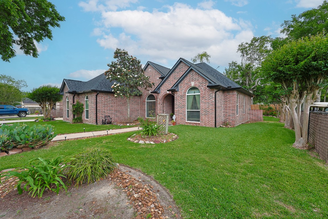 4704 Donald Street Seabrook, TX 77586 - Photo 3 of 42 a front view of a house with garden