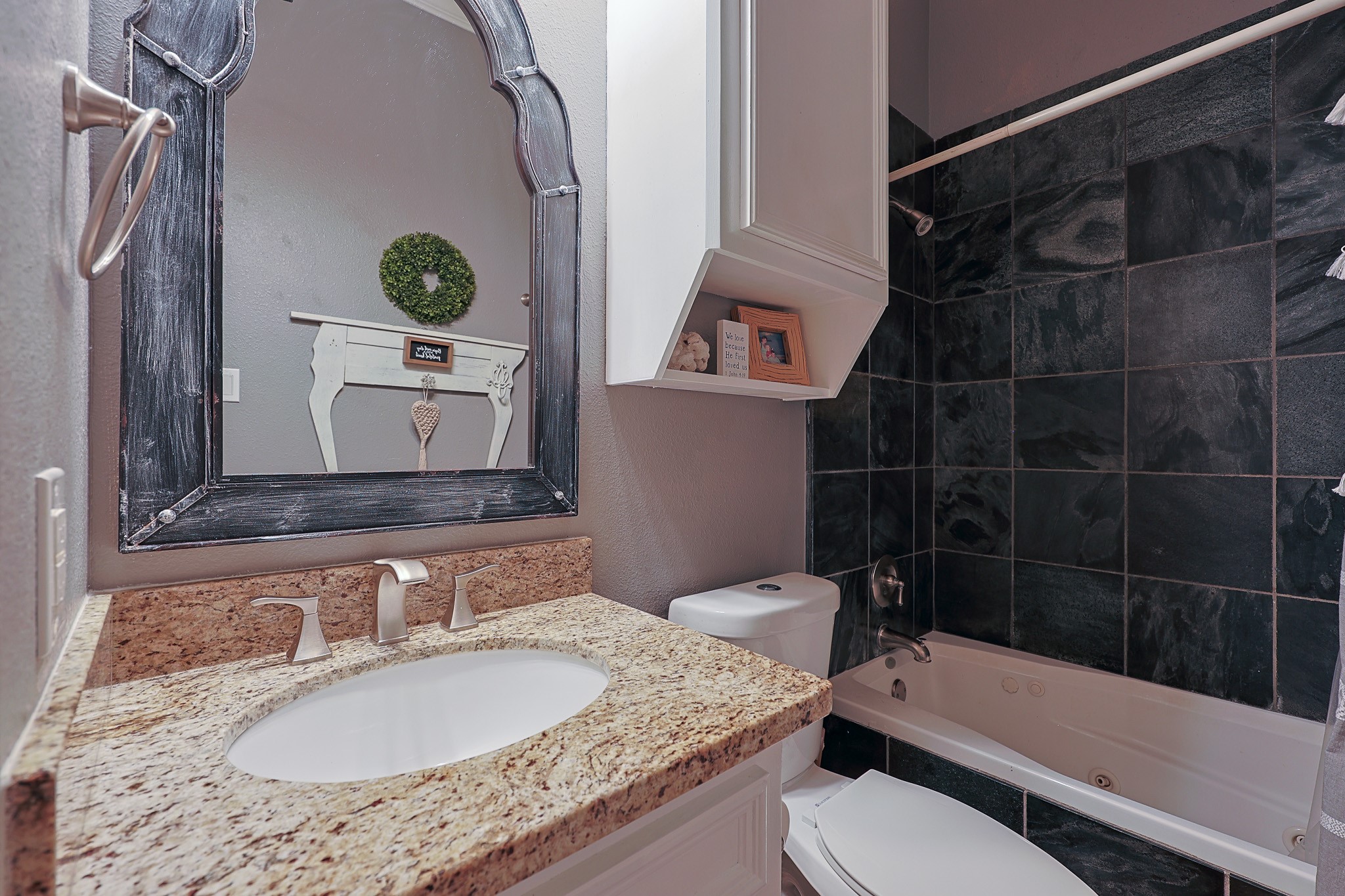 4704 Donald Street Seabrook, TX 77586 - Photo 31 of 42 a bathroom with a granite countertop sink toilet and shower
