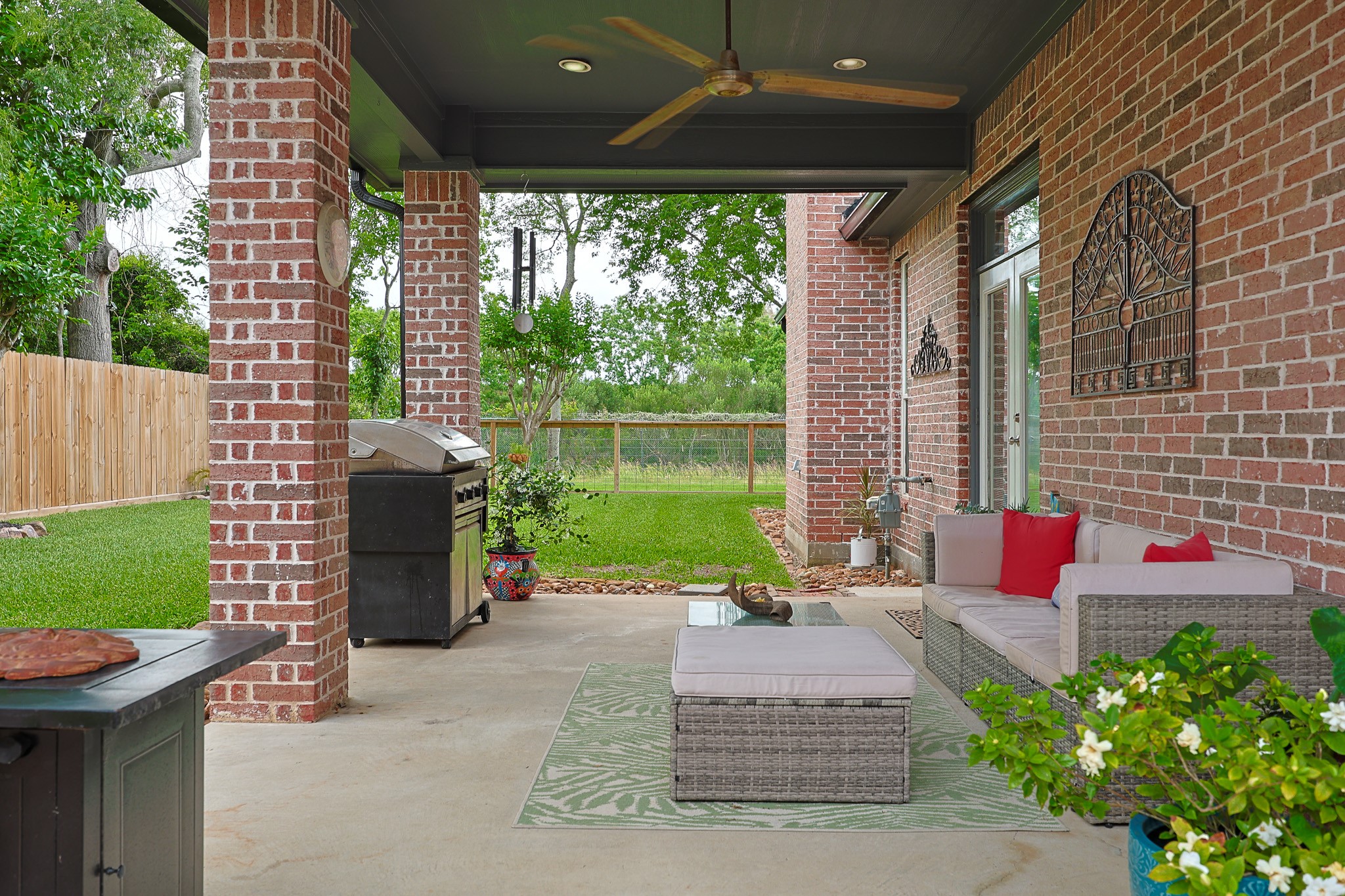 4704 Donald Street Seabrook, TX 77586 - Photo 33 of 42 a view of a patio with a table chairs and a yard
