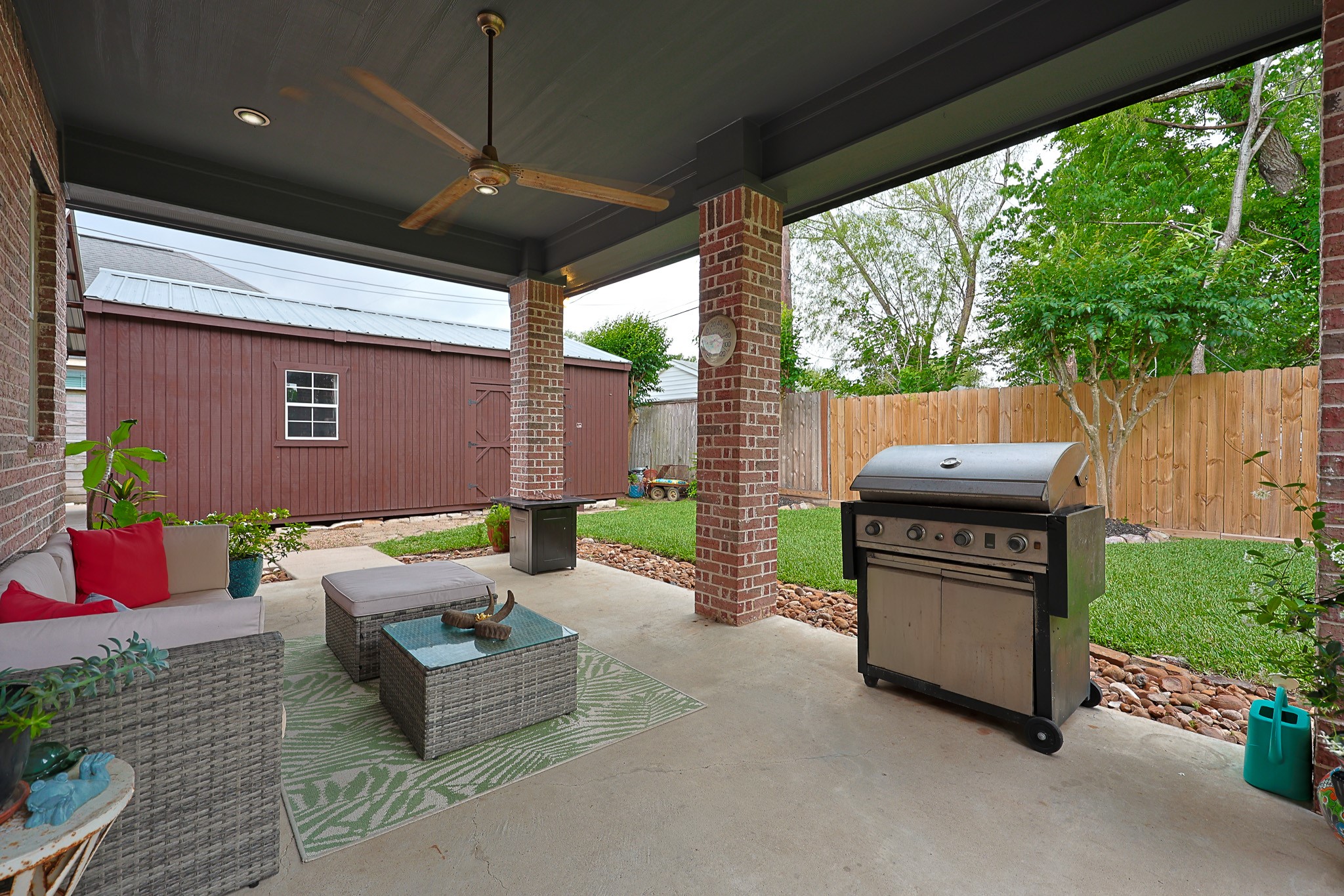 4704 Donald Street Seabrook, TX 77586 - Photo 34 of 42 a outdoor space with patio the couches and a dining table with garden view