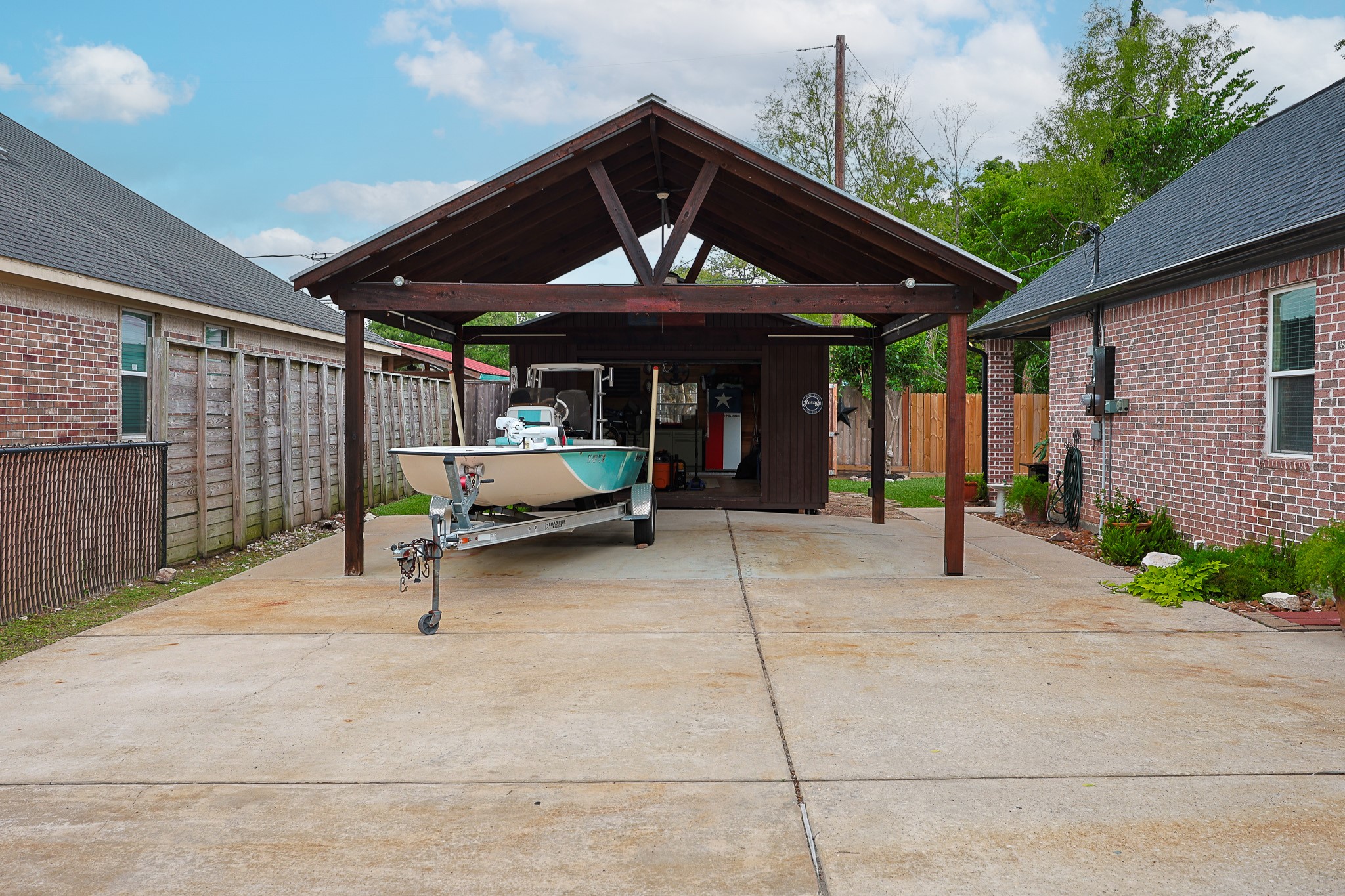 4704 Donald Street Seabrook, TX 77586 - Photo 5 of 42 a view of a patio with a table and chairs under an umbrella