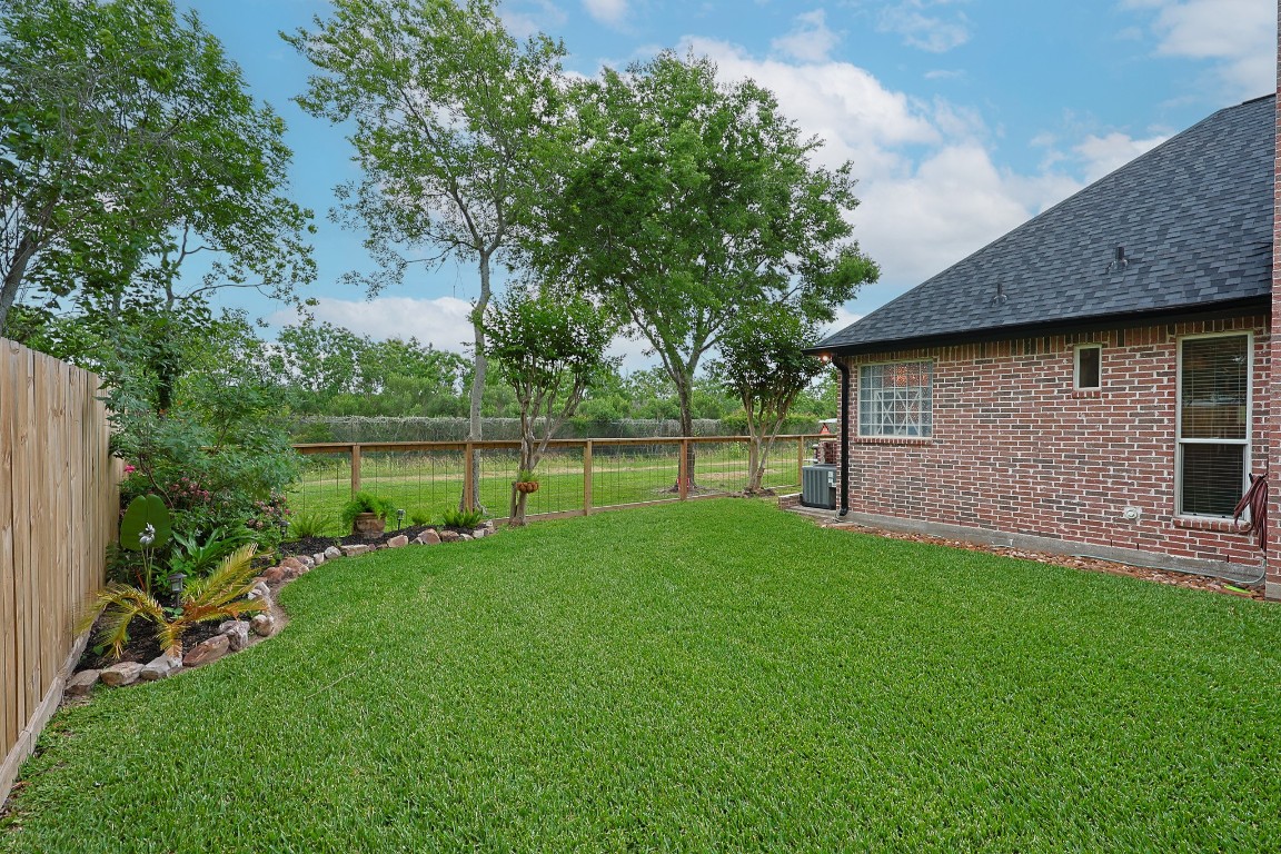 4704 Donald Street Seabrook, TX 77586 - Photo 6 of 42 a view of a backyard with a garden