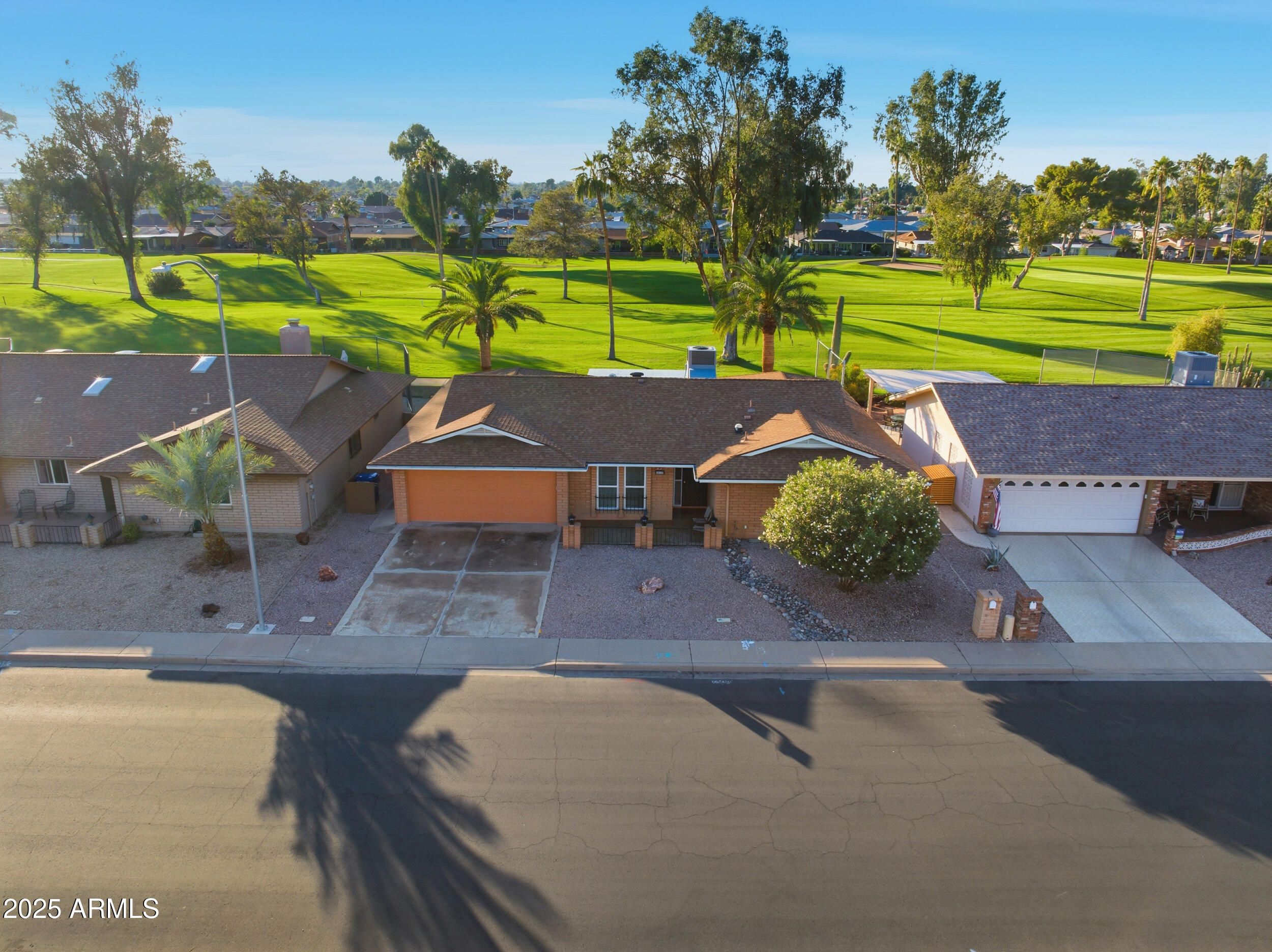 an aerial view of a house with a yard and a garden