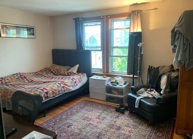 24 P Street, Unit 2 Boston, MA 02127 - Photo 5 of 10 a bedroom with a bed and a couch