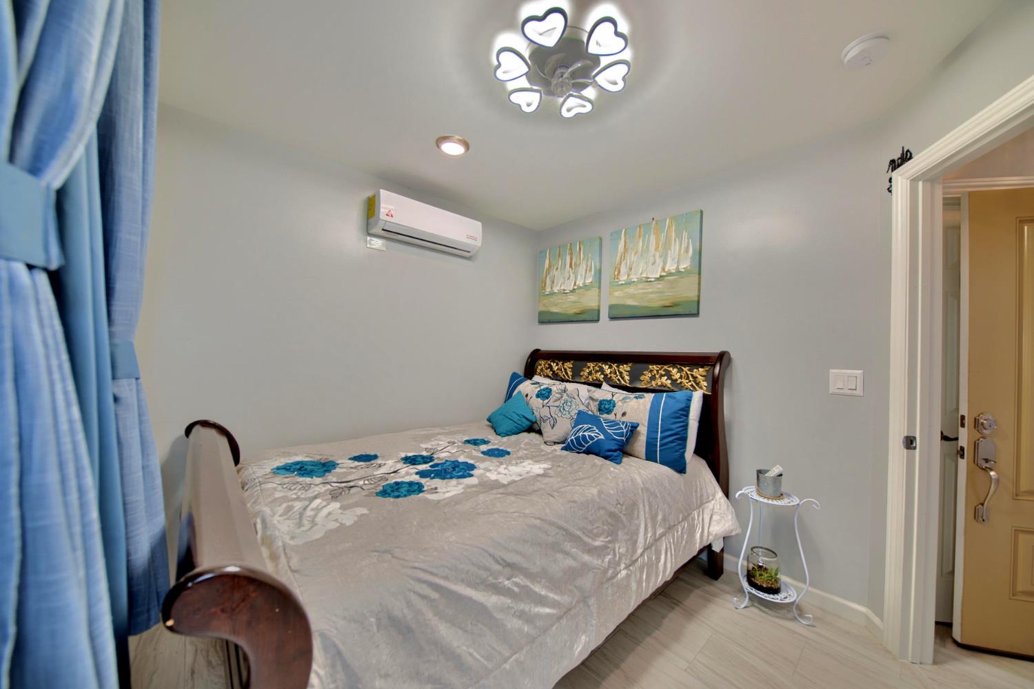 2013 Robertson Road Modesto, CA 95351 - Photo 18 of 24 a bedroom with a bed and a chandelier