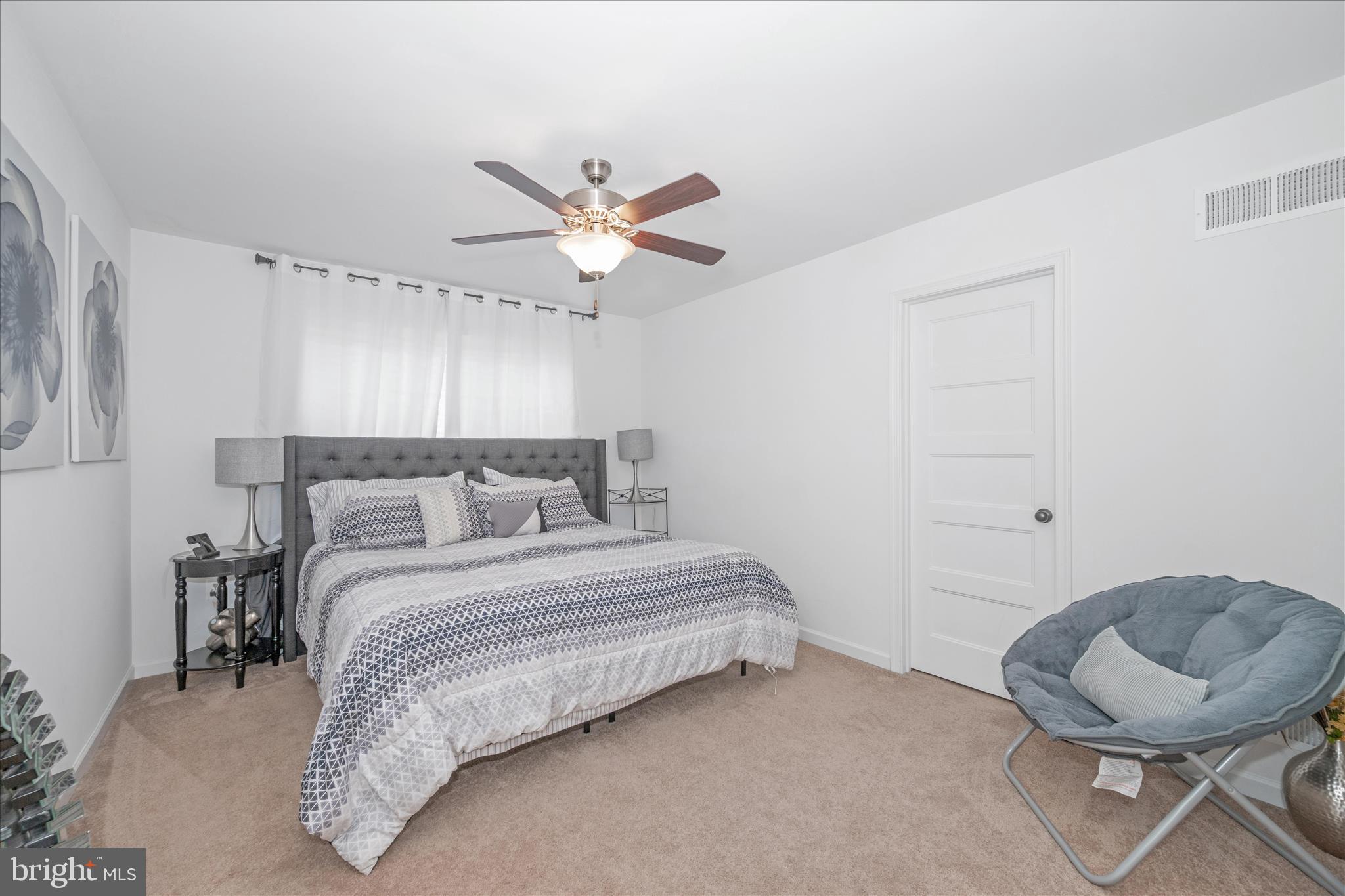 1388 Rocky Springs Road Frederick, MD 21702 - Photo 40 of 97 a bedroom with a bed and a chair