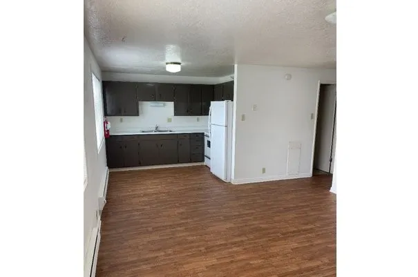 a view of kitchen with a sink and cabinets