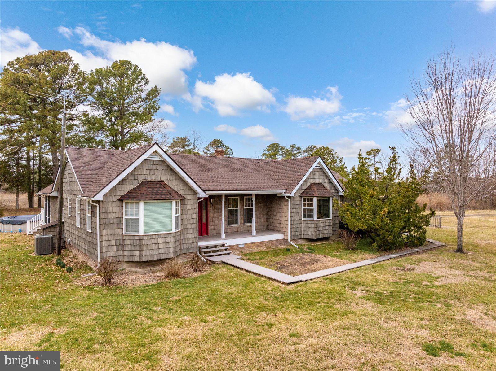 9554 Millard Long Road Westover, MD 21871 - Photo 1 of 69 a view of a house with a small yard and large tree