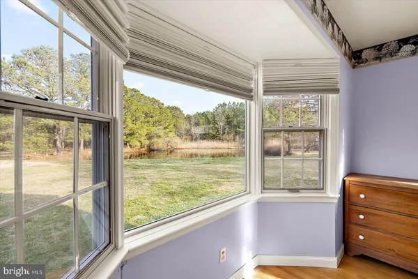 a bedroom with furniture and windows
