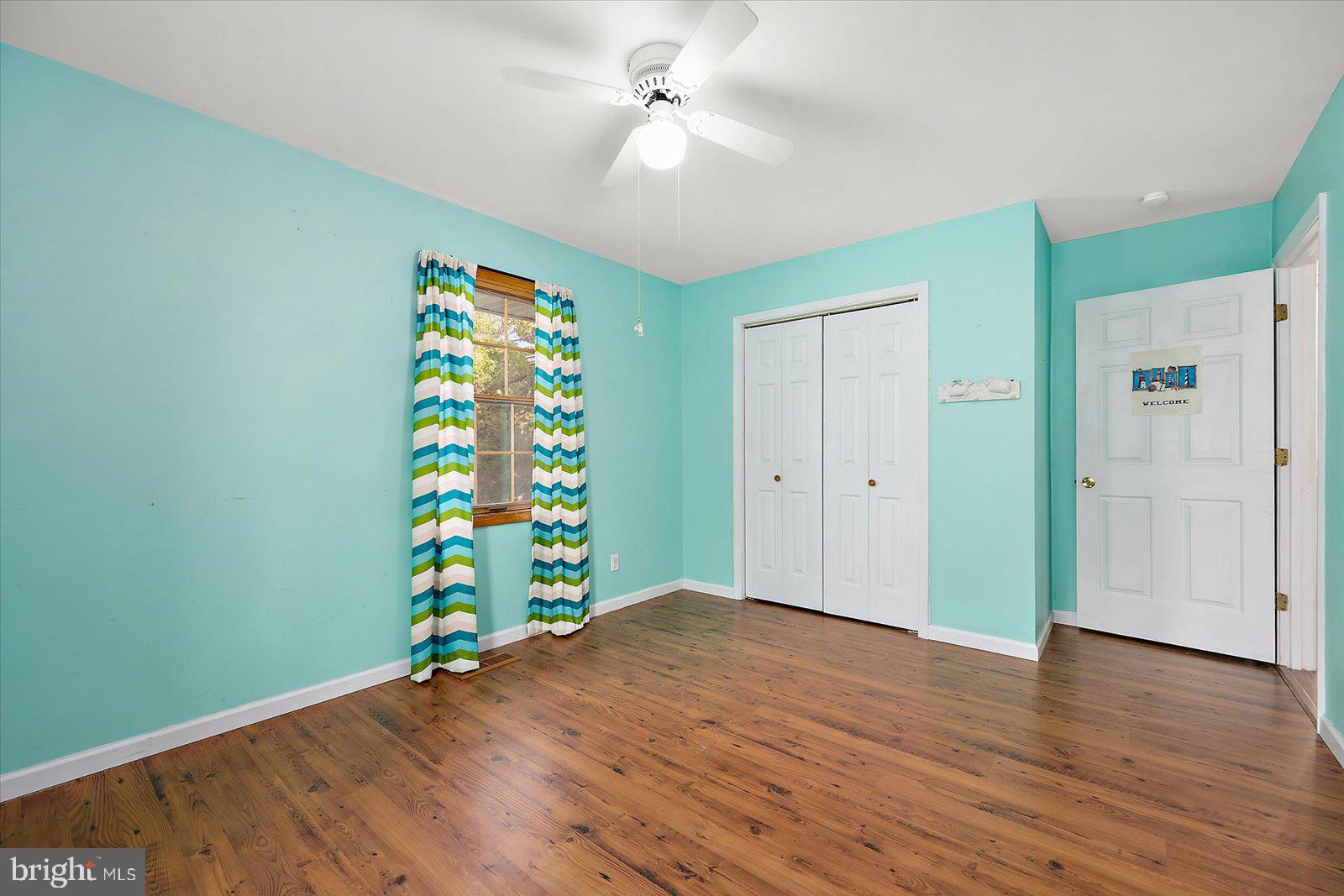 9554 Millard Long Road Westover, MD 21871 - Photo 24 of 69 an empty room with wooden floor and entryway