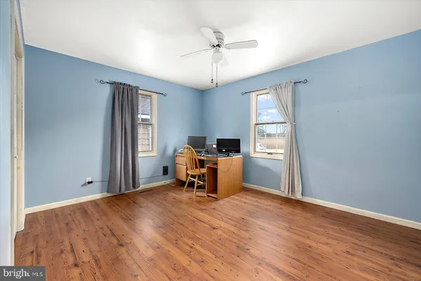 a view of an empty room with a balcony