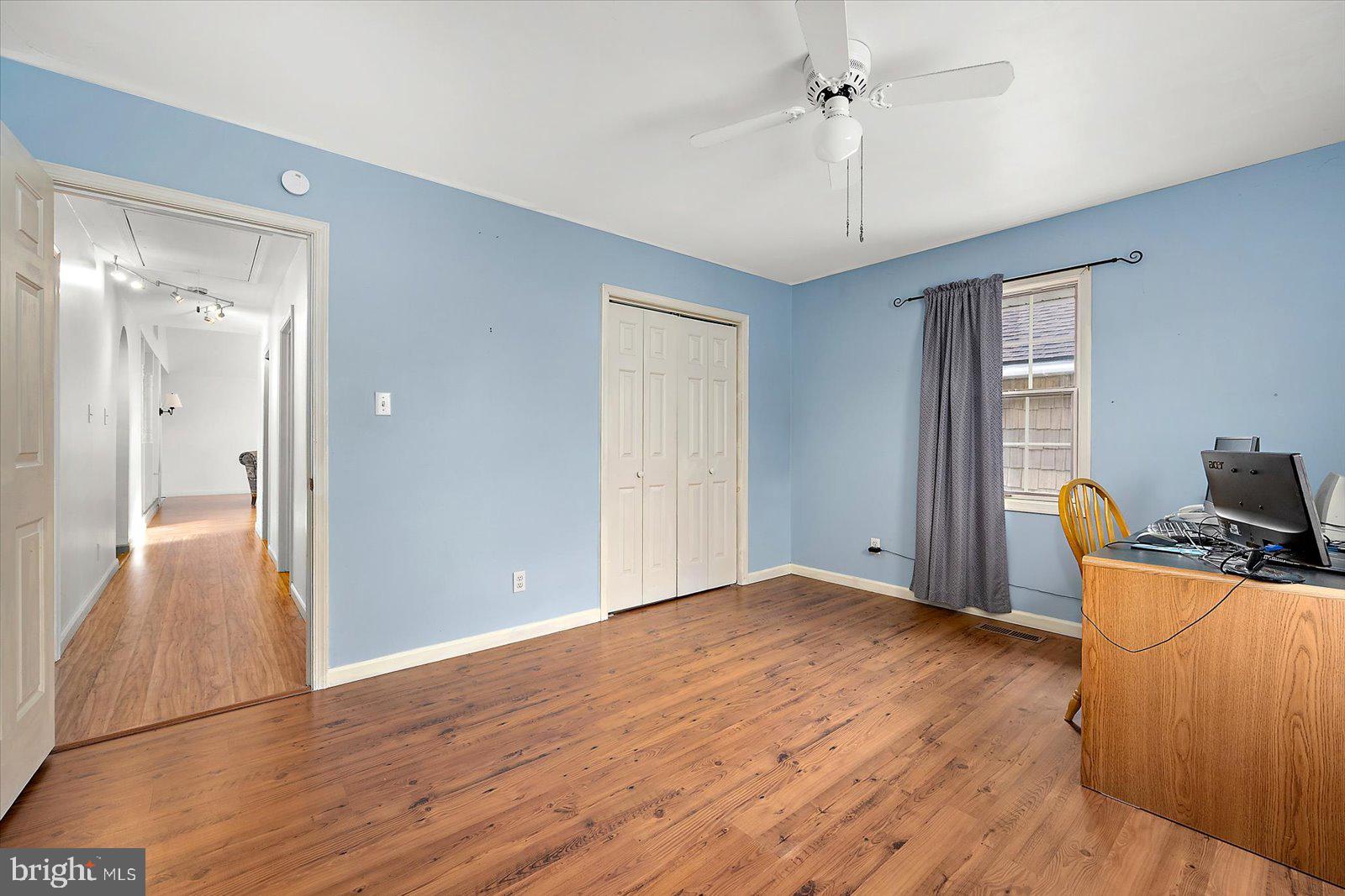 9554 Millard Long Road Westover, MD 21871 - Photo 26 of 69 a view of empty room with wooden floor and fan