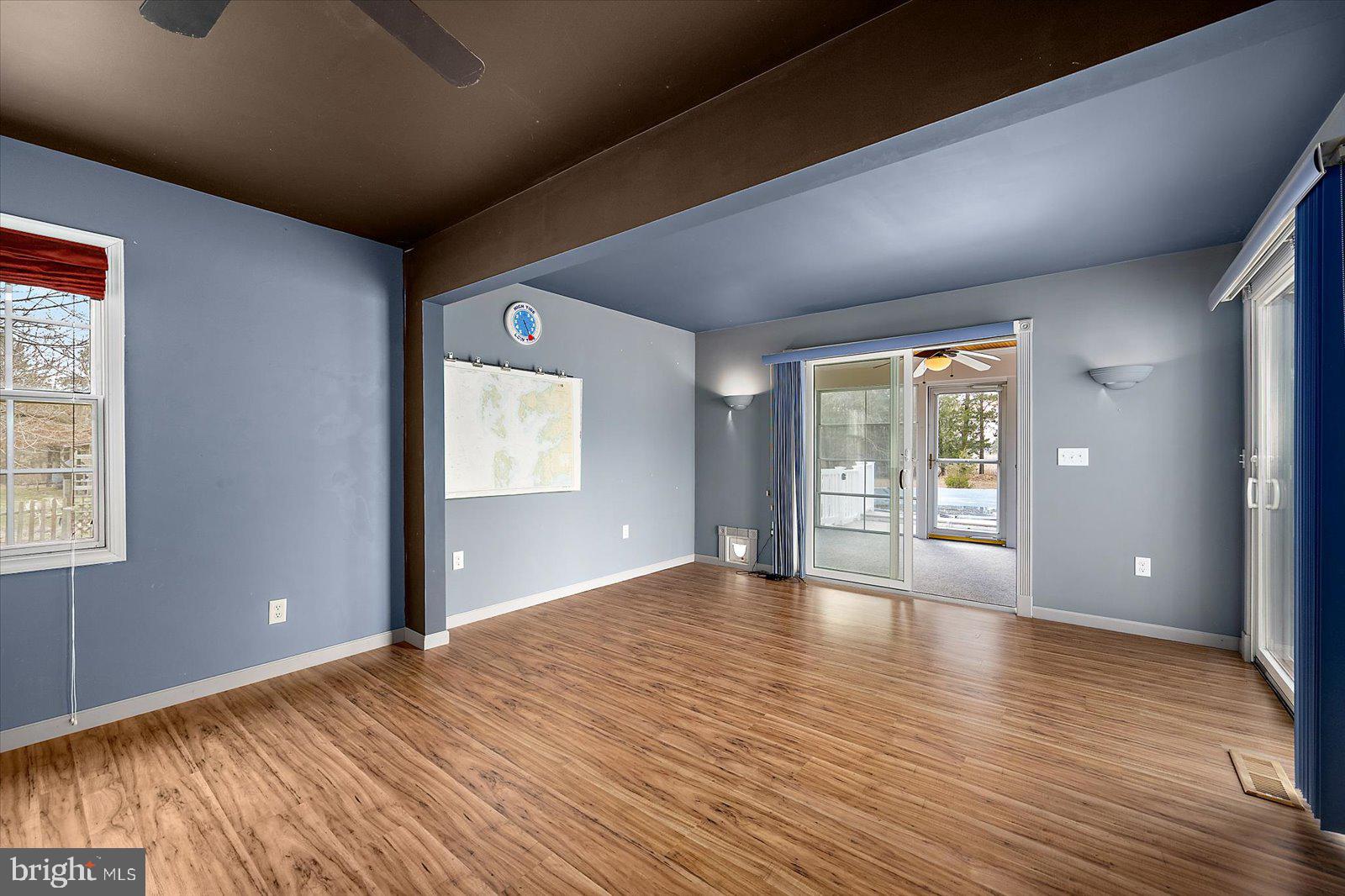 9554 Millard Long Road Westover, MD 21871 - Photo 27 of 69 a view of an empty room with window and wooden floor