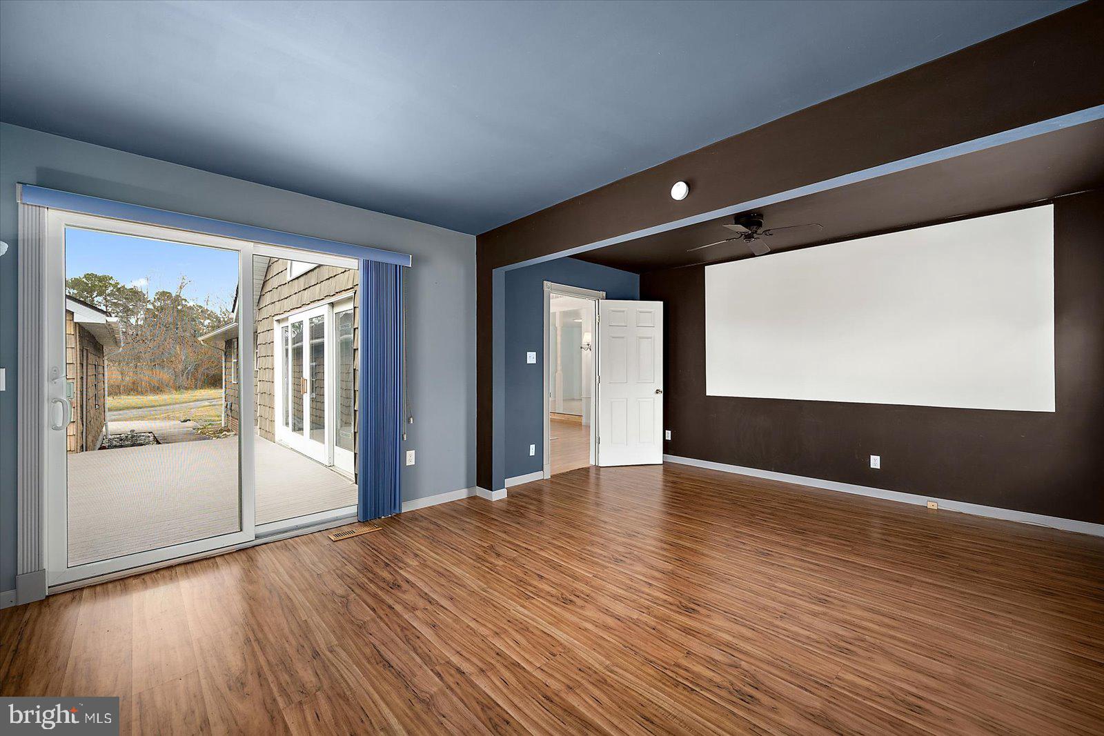 9554 Millard Long Road Westover, MD 21871 - Photo 28 of 69 a view of an empty room with wooden floor and a window