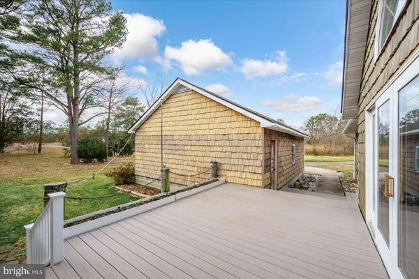 a view of a lake with outdoor seating