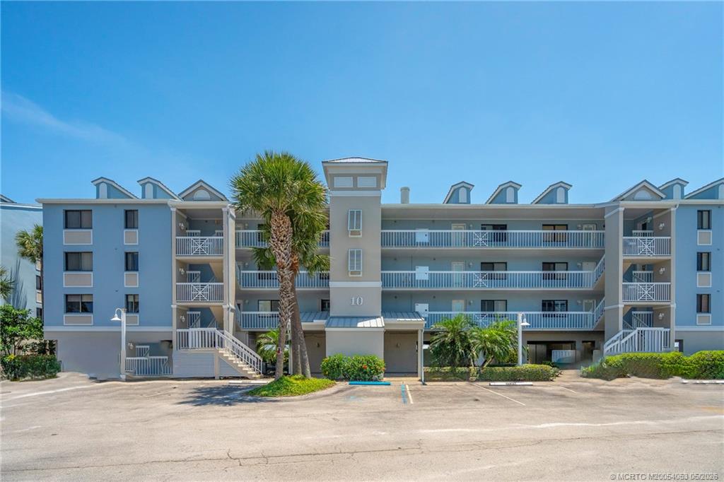 10 Northeast Plantation Road, Unit 101 Jensen Beach, FL 34957 - Photo 25 of 53 a view of building with a street