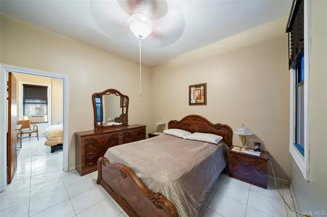 a bed room with a bed and a chandelier