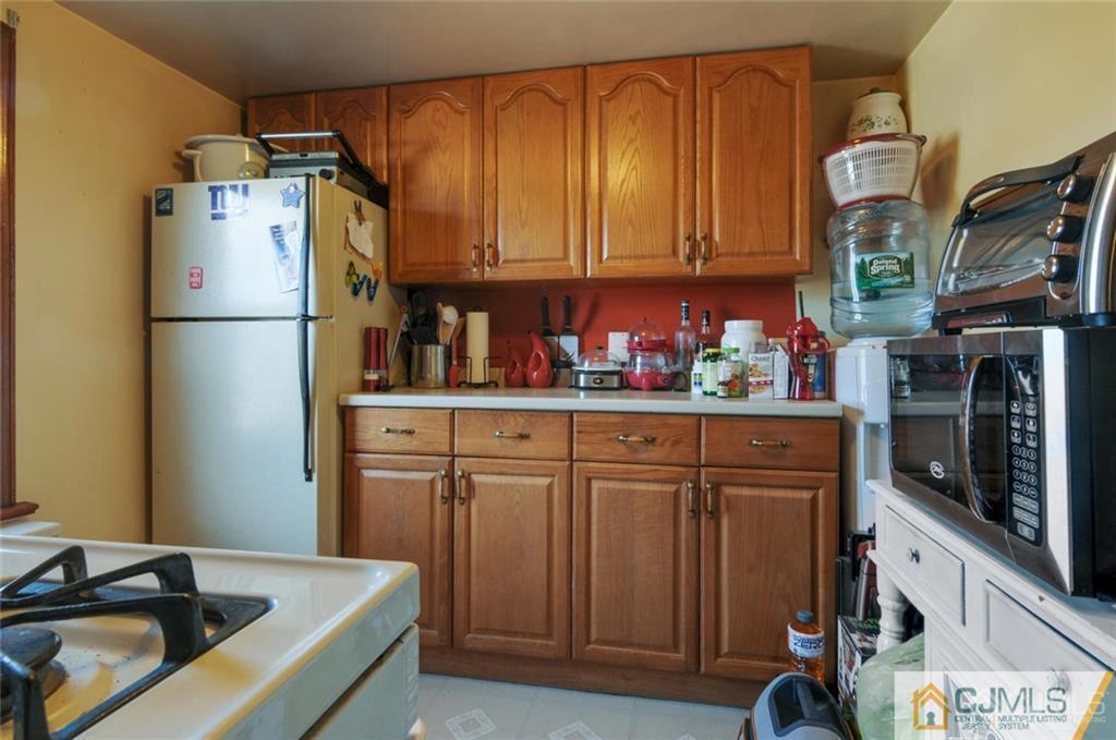 136 McFarlane Road Colonia, NJ 07067 - Photo 11 of 23 a kitchen with stainless steel appliances granite countertop a refrigerator and a sink