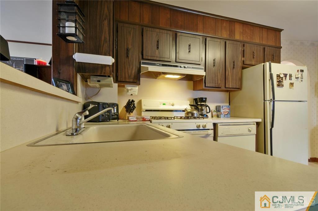 136 McFarlane Road Colonia, NJ 07067 - Photo 13 of 23 a kitchen with stainless steel appliances a refrigerator sink and cabinets