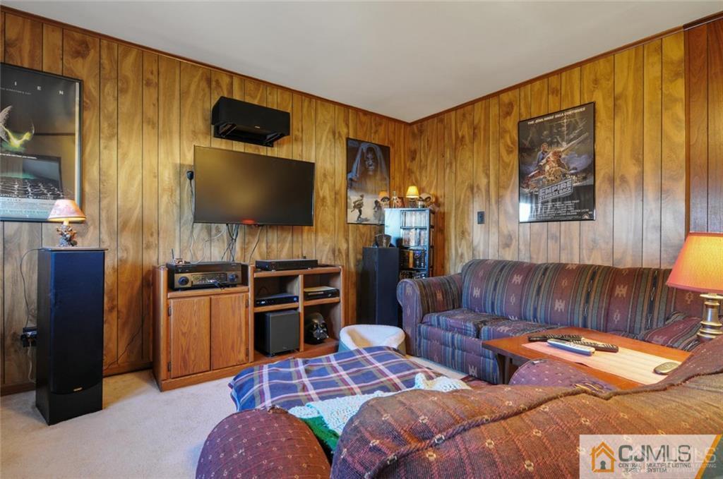 136 McFarlane Road Colonia, NJ 07067 - Photo 15 of 23 a bedroom with furniture and a flat screen tv
